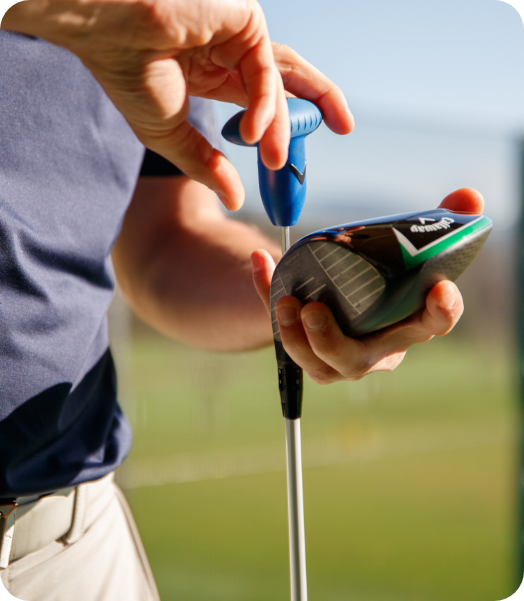 A person fitting a golf club